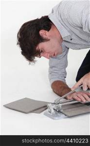 Man using a tile cutter