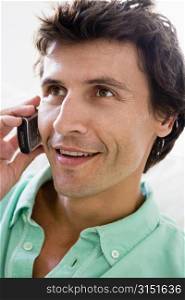 Man using cellular phone and smiling