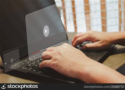 Man using computer laptop virtual icon watching video on internet. modern Internet technology , Social Networking, online marketing, digital online. concept technology