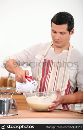 Man using electric whisk