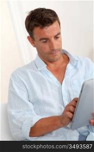 Man using electronic tablet