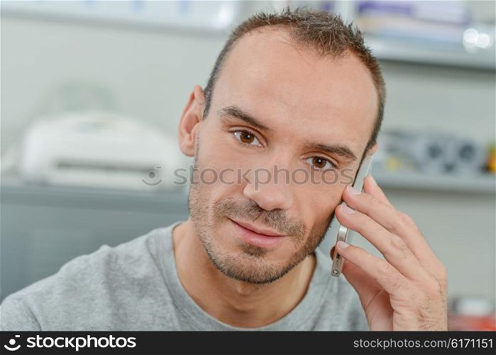 Man using his cellphone in the office