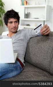 Man using his credit card online