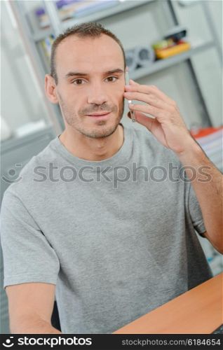 Man using his mobile at the office