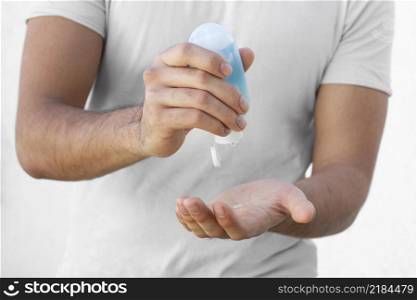 man using hydroalcoholic gel