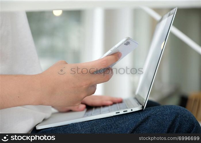 Man using laptop computer and smart phone, people and technology, lifestyles