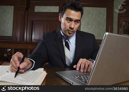 Man using laptop in court