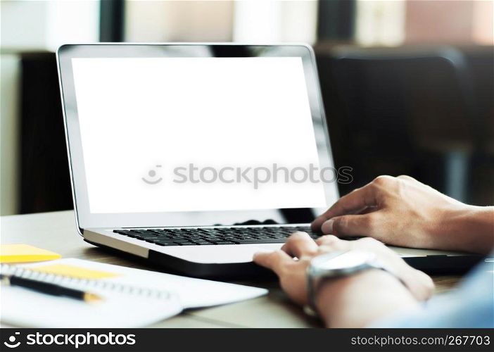 man using laptop with blank screen at modern office