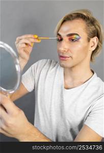 man using make up cosmetics