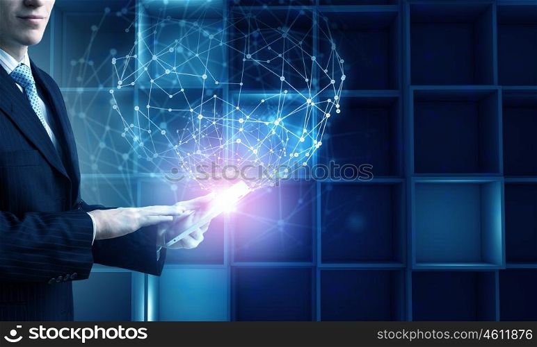 Man using modern technologies. Hands of businessman with tablet pc against high tech background
