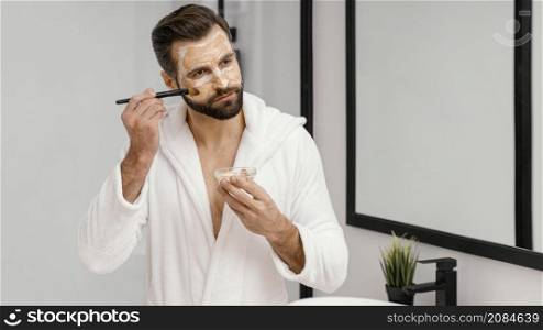 man using natural ingredients face mask