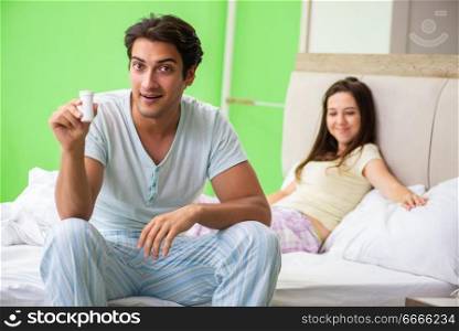 Man using pills for woman satisfaction  . The man using pills for woman satisfaction  