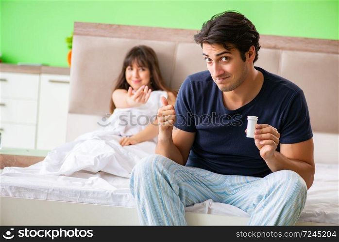Man using pills for woman satisfaction  . The man using pills for woman satisfaction  