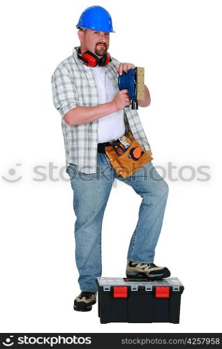 Man using power sander