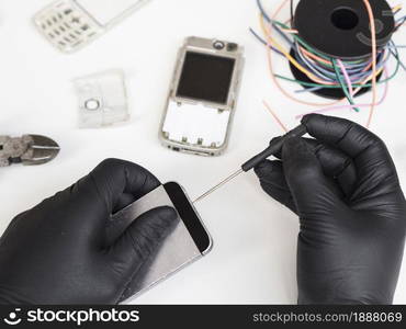 man using screwdriver open phone . Resolution and high quality beautiful photo. man using screwdriver open phone . High quality and resolution beautiful photo concept