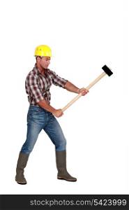 Man using sledge-hammer