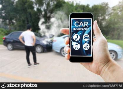 Man using smart phone for car insurance after accident. Outdoor and closeup.