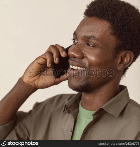 man using smartphone talking close up