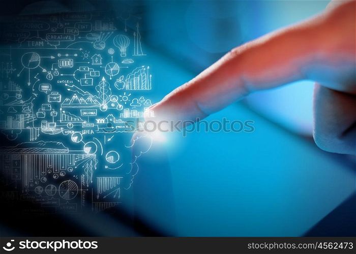 Man using tablet. Close up of human hand touching screen of tablet