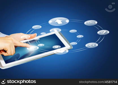 Man using tablet. Close up of human hand touching screen of tablet