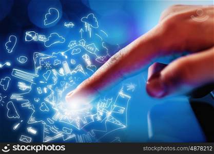 Man using tablet. Close up of human hand touching screen of tablet