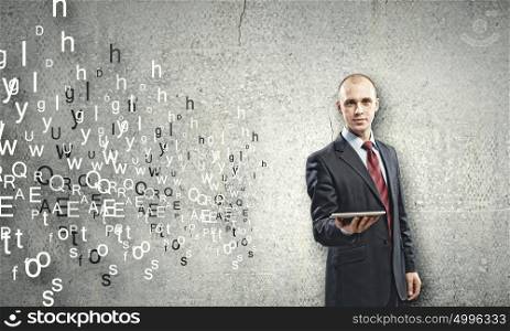 Man using tablet pc. Young businessman holding tablet pc and letter flying in air
