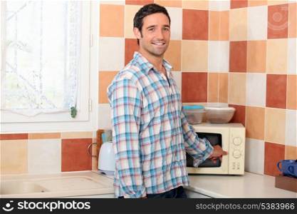 Man using the microwave