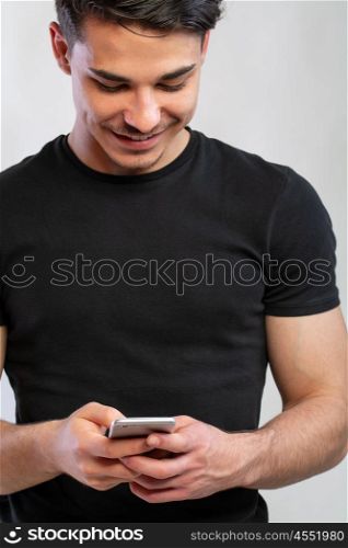 man using the phone. a young man with black using the phone, hand grabing a phone