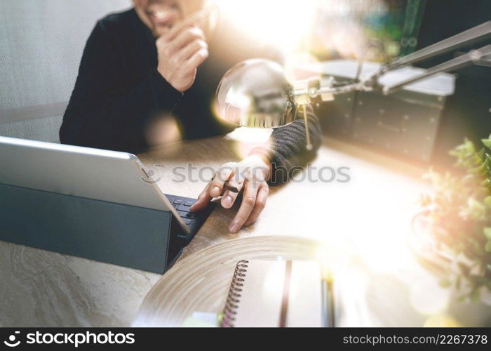 Man using VOIP headset with digital tablet computer docking smart keyboard, concept communication, it support, call center and customer service help desk,filter film effect