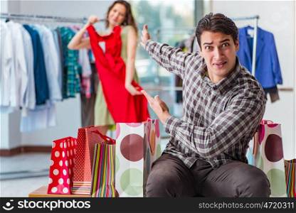 Man waiting for his wife during christmas shopping
