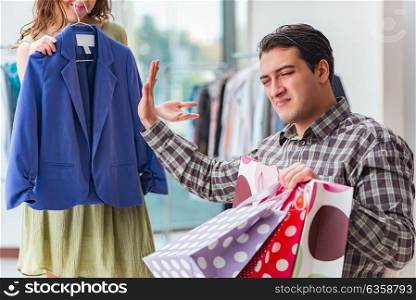 Man waiting for his wife during christmas shopping