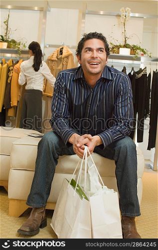 Man Waiting in Boutique