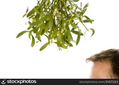 Man Waiting Under Bunch Of Mistletoe Against White Background
