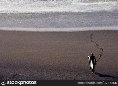 Man walking at beach, elevated view