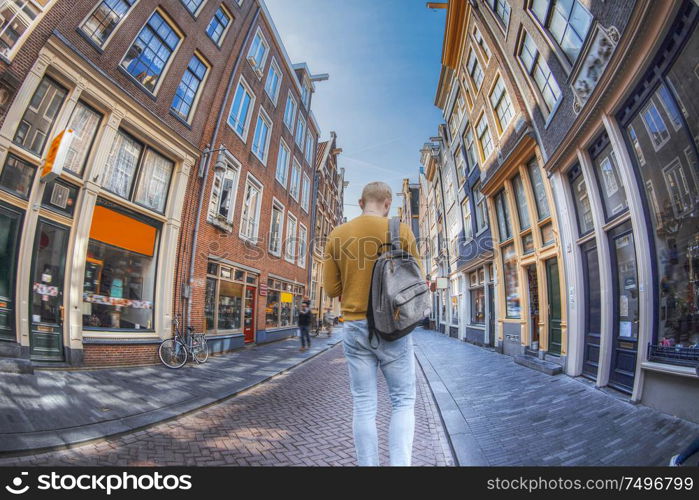 man walking down the street of Amsterdam. The Netherlands