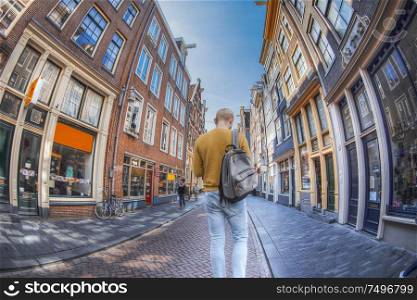 man walking down the street of Amsterdam. The Netherlands