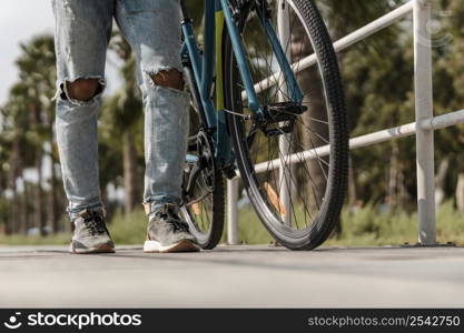 man walking his bike 2