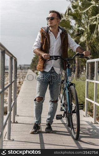 man walking his bike