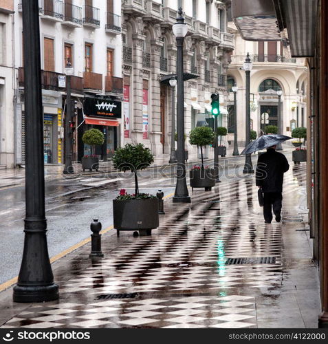 Man walking in rain