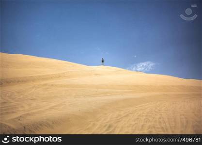 man walking in the desert in Peru