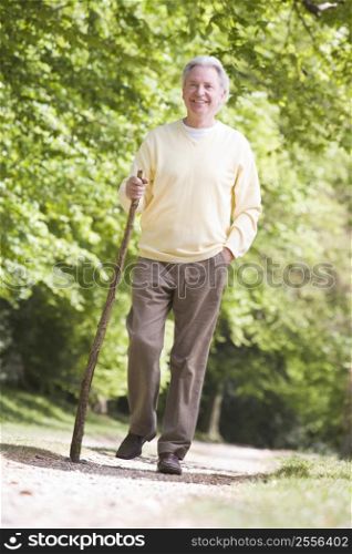 Man walking outdoors smiling