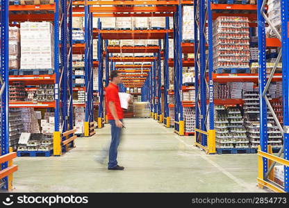 Man Walking Through Warehouse
