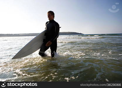 Man walking with a surfboard