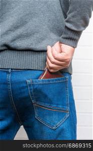 Man wallet pockets his jeans