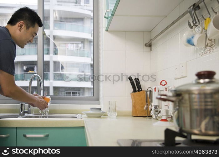 Man washing a sponge