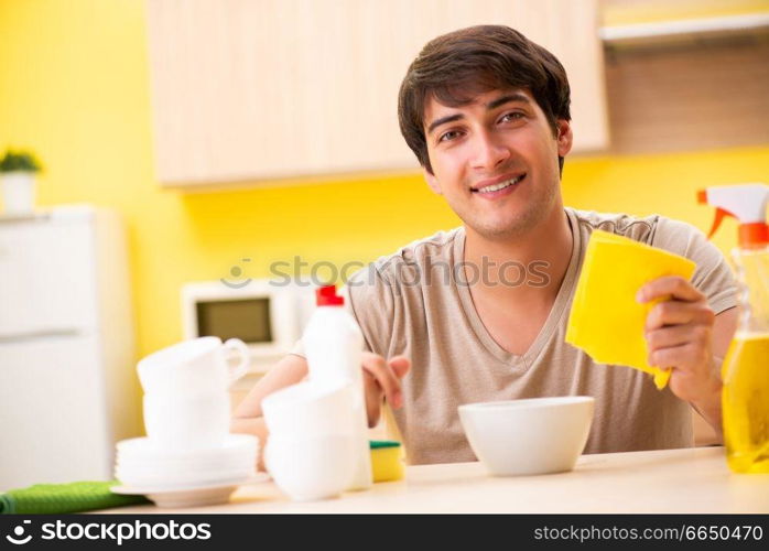 Man washing dishes at home