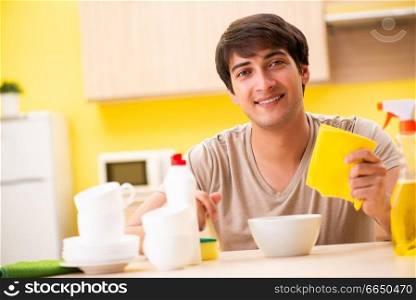 Man washing dishes at home