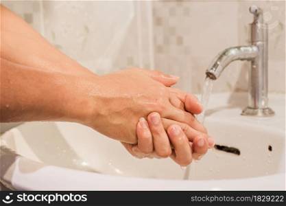 Man washing hands rubbing with soap prevention for coronavirus, Close up