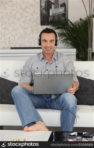 Man watching a movie on laptop