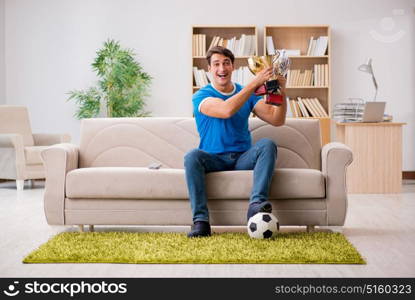 Man watching football at home